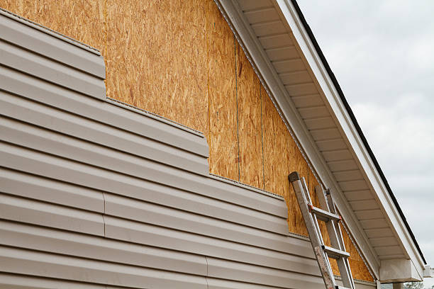 Professional Siding Installation technician working in New Smyrna Beach, FL